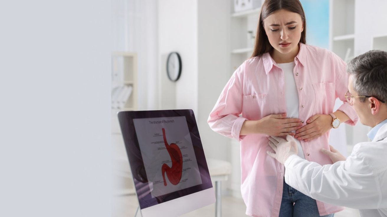doctor consulting a patient about stomach pain in a modern clinic.