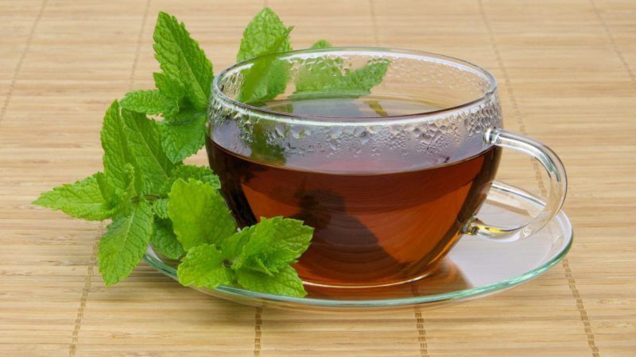 Peppermint  tea with fresh mint leaves for easing gas and stomach cramps.